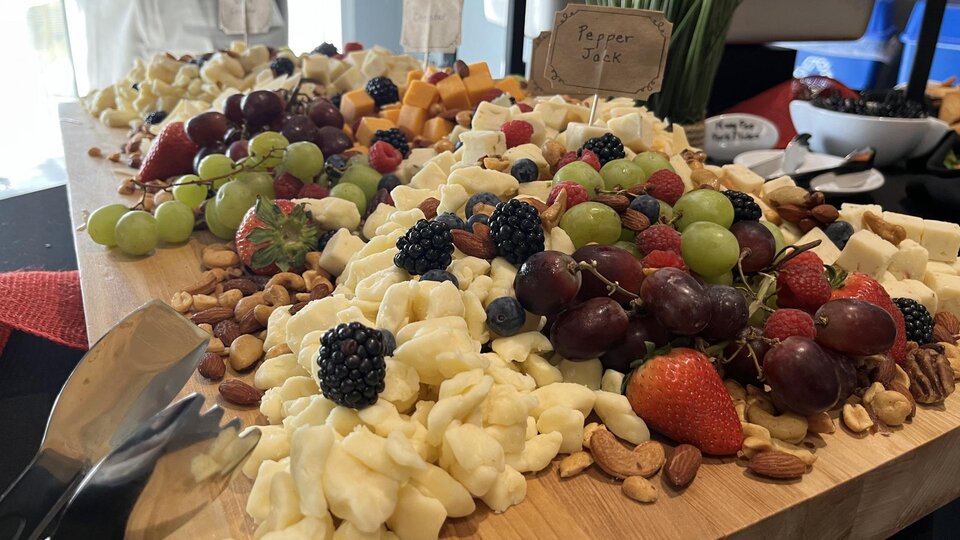 Cheese and fruit board displayed at a catering event